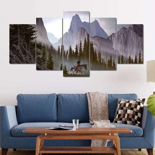 The Mountaineer - Canvas Print - stunning wall art featuring a watercolor painting of a man riding a horse on the mountains - this wall print brings peace and calmness to the space | NicheCanvas