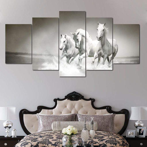 Three White Horses - Canvas Print - gorgeous wall art of herd of horses running - this beautiful art print is the perfect focal point on any room | NicheCanvas