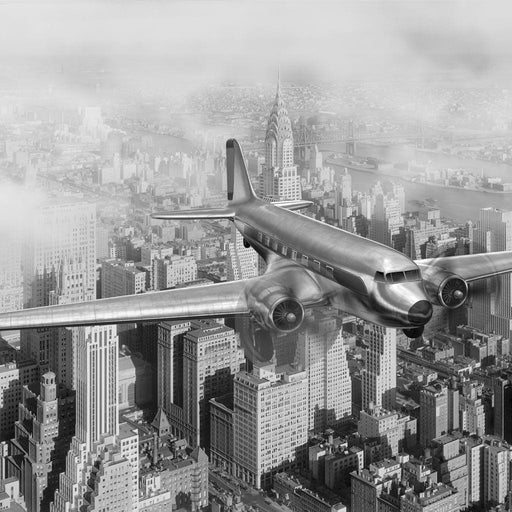 DC-3 Over New York - Canvas Print - black and white wall art of an airplane flying over the city - this vintage home decor is made with high quality canvas and ink | NicheCanvas
