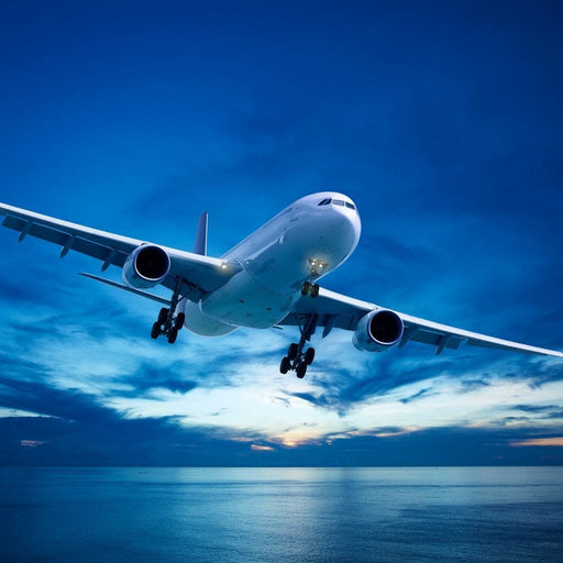 Airplane Over The Sea - Canvas Print - modern wall art print of an airplane flying over the sea - this canvas painting will bring the beauty of art in your home | NicheCanvas